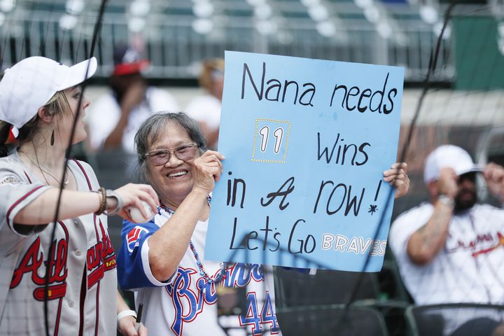 A Braves fan shows support with a special request for the team to continue the winning streak Sunday, June 12, 2022, in Atlanta. (Miguel Martinez / miguel.martinezjimenez@ajc.com)