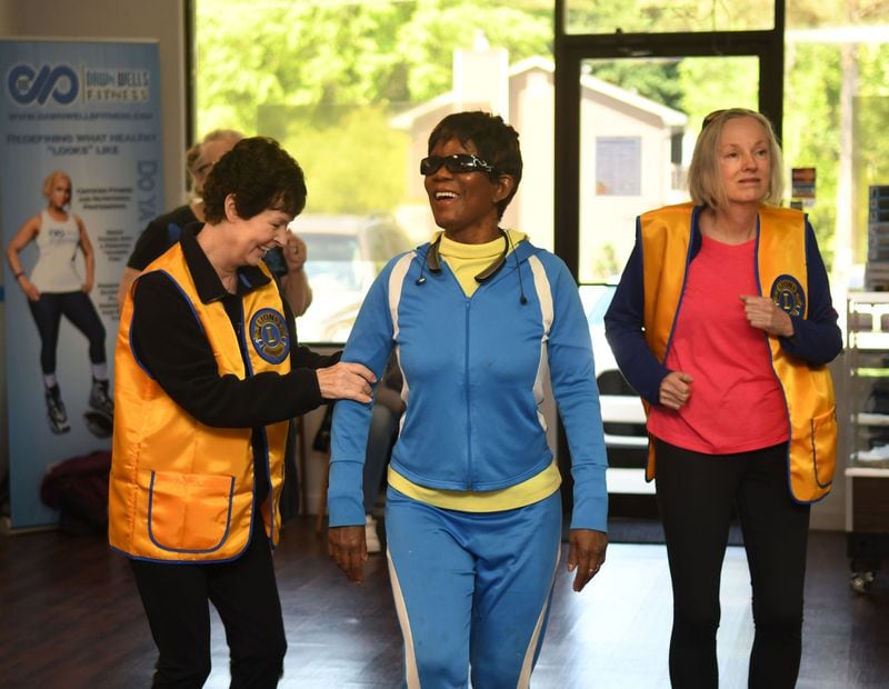 Marti Colglazier of Conyers (left), a Lions Club volunteer, Rosetta Brown of Conyers, and Kay Wilson of Conyers, a Lions Club volunteer, participate in a recent exercise class at Dawn Wells Fitness in Covington. Angel Eyes Fitness and Nutrition provides exercise instruction to the blind and visually impaired. CONTRIBUTED BY REBECCA BREYER
