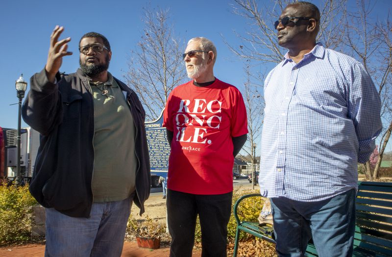 Josh Byrd, left, speaks to other members of the Better Together group, including Lynn Bouchillow, center, and James Tuck. Byrd, who owns a barbershop in Alpharetta, says he was raised to be wary of visiting Forsyth County. (Steve Schaefer for The Atlanta Journal Constitution)