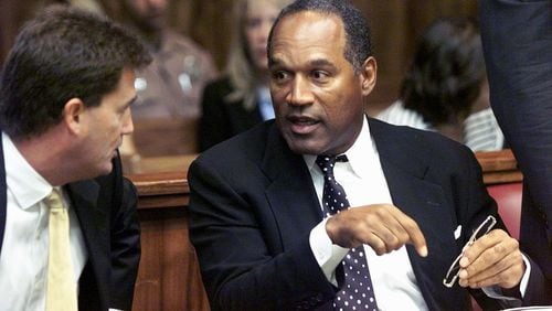 395562 04: Former NFL star O.J. Simpson talks with one of his defense attorneys on the first day of jury selection October 9, 2001 at a Dade County courtroom in Miami, FL. Simpson, who was acquitted in 1994 in the murders of his ex-wife and her friend, is on trial for allegedly attacking a motorist in the Miami suburb of Kendall, Florida in December of 2000. If found guilty, Simpson could face up to 16 years in prison. (Pool Photo/Getty Images)