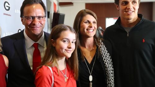 March 16, 2018 Athens: Tom Crean, his wife Joani (the former Joani Harbaugh), son Riley, 18, and daughter Ainsley, 12, gather for a family photo after Crean was introduced as the new men's basketball head coach at the University of Georgia on Friday, March 16, 2018, at Stegeman Coliseum in Athens.  Curtis Compton/ccompton@ajc.com