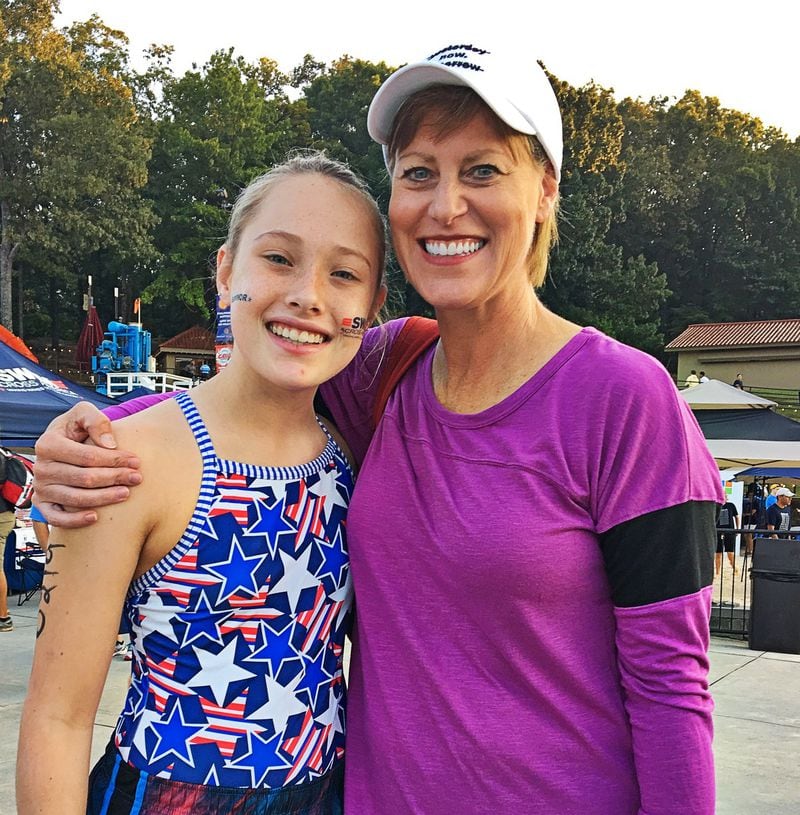 Grace Bunke with her mom, Vicki, at Swim Across America last year. CONTRIBUTED