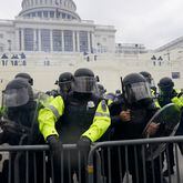Police try to hold back protesters who gather to storm the U.S. Capitol and halt a joint session of the 117th Congress on Jan. 6 in Washington, D.C.