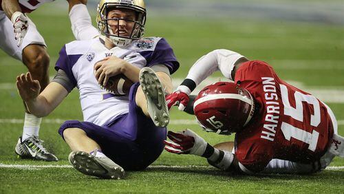 Alabama defensive back Ronnie Harrison tackles Washington quarterback Jake Browning on a quarterback keeper during the second quarter in the Chick-fil-A Peach Bowl at the Georgia Dome on Saturday, Dec. 31, 2016, in Atlanta. Curtis Compton/ccompton@ajc.com