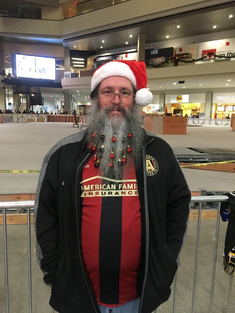 Atlanta United fan Robert Angus shows off stratigically placed red and black ornaments (in five stripes) dangling in his long white beard before the big game on Saturday, December 8, 2018, at Mercedes-Benz Stadium. (Photo by Amanda Coyne/AJC)