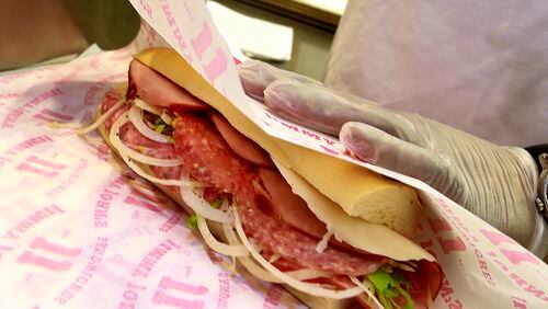 An Italian Sub at Jimmy John's gets wrapped to go.