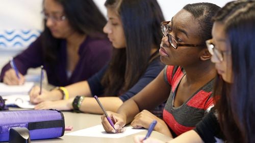 Sep. 1, 2015 - Lawrenceville - Dominique Jeanty, 16, takes notes during her differential equations class at the Gwinnett School of Mathematics, Science, and Technology in Lawrenceville which had the highest combined SAT score among all high schools in Georgia for 2015. BOB ANDRES / BANDRES@AJC.COM
