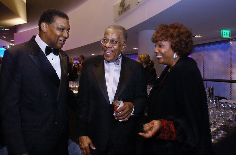 Robert Hightower (left), Elridge McMillan (center) and Betty Hightower, wife of Robert Hightower, share a moment at a pre-dinner reception at the Regents' Awards for Excellence in Education at the Georgia Aquarium in Atlanta on January 28, 2005. McMillan, who is a lifetime educator, is the namesake for the Elridge McMillan Lifetime Achievement Award, which is presented at this dinner. (credit: Kimberly Smith / AJC file photo)