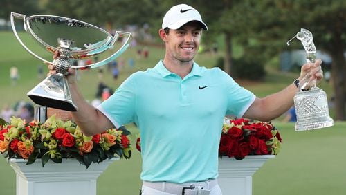 Rory McIIroy with his hardware after winning the Tour Championship and the FedEx Cup by sinking a birdie putt on the fourth playoff hole during the final round of the Tour Championship at East Lake Golf Club on Sunday, Sept. 25, 2016, in Atlanta. McIlroy beat Ryan Moore and Kevin Chappell in a three way playoff.   Curtis Compton /ccompton@ajc.com