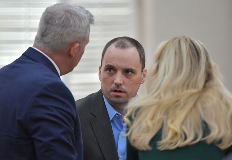 Ryan Alexander Duke (center), who is charged with murder in the Grinstead case, confers with his attorneys John Merchant (left) and Ashleigh Merchant (right) during a motion hearing at Irwin County Courthouse in Ocilla, Georgia, on November 26, 2018. (HYOSUB SHIN / HSHIN@AJC.COM)