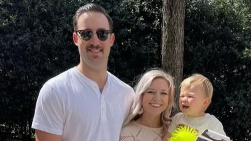 Michael Crosby is seen with his wife and child. The firefighter had multiple surgeries after he was injured in an accidental shooting at a Union City fire station last Wednesday, officials said.