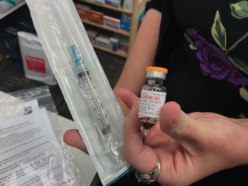 Narcan can be administered at least three different ways: with a nasal spray, an intramuscular injection or an auto-injector. Pictured is a syringe and a vial for the intramuscular injection.  BO EMERSON / BEMERSON@AJC.COM