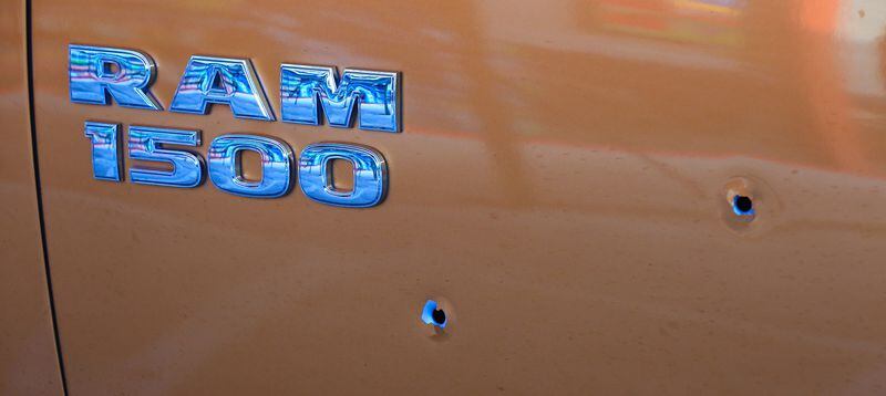 Bullets hit the side of Stacey Arbee's Dodge Ram as he was driving down Ga. 166 Tuesday morning. Arbee was shot in the leg. JOHN SPINK / JSPINK@AJC.COM