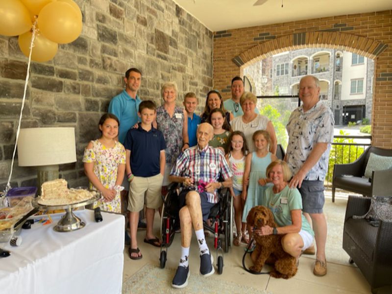 Don Goldberg, a resident at The Terraces at Peachtree Hills Place in Buckhead, celebrates a recent birthday with his family on one of the facility’s outdoor terraces
