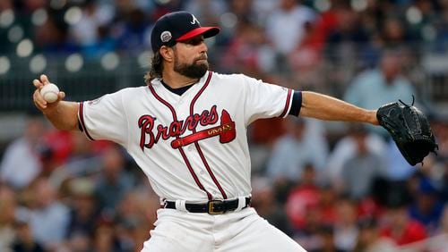 Braves starter R.A. Dickey works in the first inning Monday&#039;s game against the Giants at SunTrust Park.