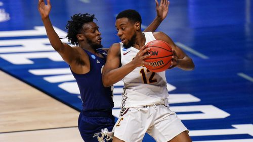 Loyola Chicago guard Marquise Kennedy, right, backs down Georgia Tech guard Bubba Parham in the first half of a college basketball game in the first round of the NCAA tournament at Hinkle Fieldhouse, Indianapolis, Friday, March 19, 2021. (AP Photo/AJ Mast)