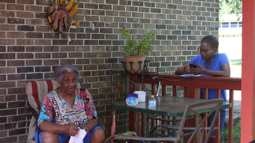 Carolyn Baker, right, speaks with Mildred Thornton of Cuthbert while canvassing for Democrat Stacey Abrams’ campaign for governor. Black rural voters could be crucial to Abrams’ effort in a tight race with Republican Brian Kemp.