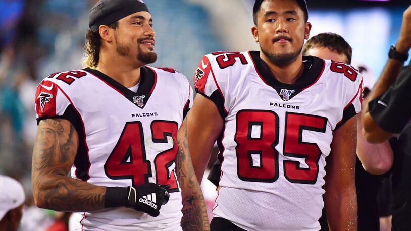 JACKSONVILLE, FLORIDA - AUGUST 29: Duke Riley #42 and Thomas Duarte #85 of the Atlanta Falcons look on during the second half of a preseason football game against the Jacksonville Jaguars at TIAA Bank Field on August 29, 2019 in Jacksonville, Florida. (Photo by Julio Aguilar/Getty Images)