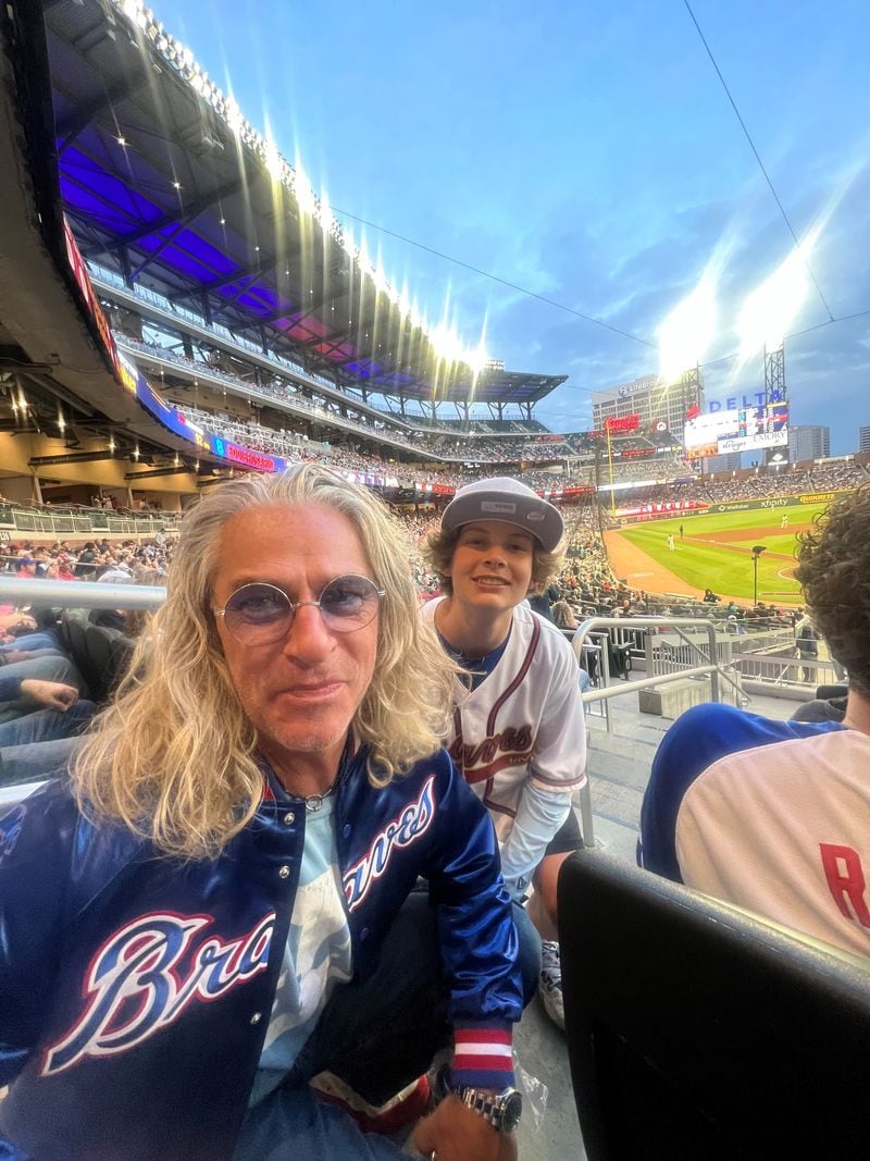 Ed Roland with his son Lennon at a Braves game. CONTRIBUTED/Ed Roland