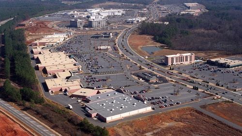 This aerial photo from 1997 shows the sprawling North Point Mall in the background. The area around Ga. 400 would continue to grow and grow into one of metro Atlanta's most important arteries. (John Spink/AJC)