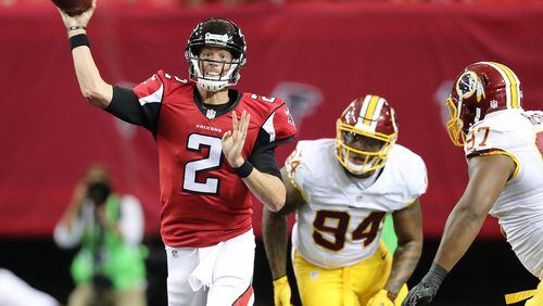 081116 ATLANTA: Falcons quarterback Matt Ryan throws an incomplete pass under pressure from Redskins linebacker Preston Smith to go three and out during the first quarter in an NFL preseason football game on Thursday, August 11, 2016, in Atlanta. Curtis Compton /ccompton@ajc.com