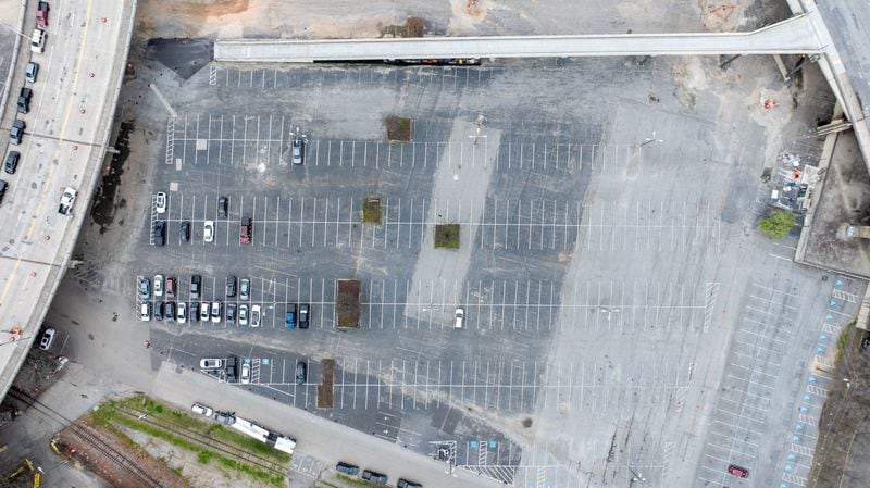A drone image shows the parking lot known as “The Gulch,” which is about to undergo significant development as part of the Centennial Yards project near Mercedes-Benz Stadium. 
Miguel Martinez /miguel.martinezjimenez@ajc.com