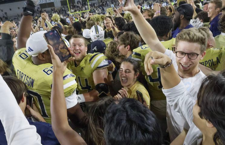 Georgia Tech players celebrate their win over North Carolina.  (Bob Andres for the Atlanta Journal Constitution)
