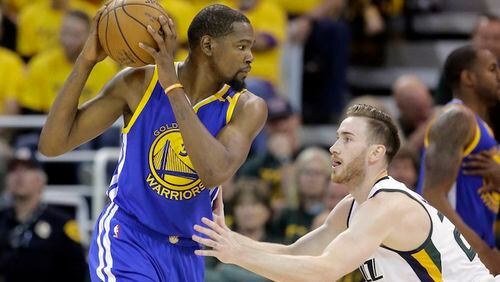 Utah Jazz forward Gordon Hayward (20) guards Golden State Warriors forward Kevin Durant (35) in the second half during Game 4 of the NBA basketball second-round playoff series Monday, May 8, 2017, in Salt Lake City. The Warriors completed a second-round sweep of the Utah Jazz with a 121-95 victory. (AP Photo/Rick Bowmer)