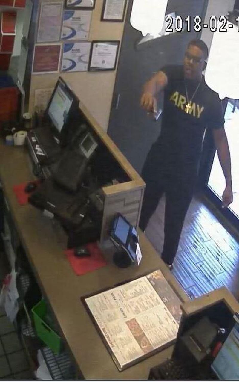 Gwinnett County police said this is an image of Trontavious D. Tate pointing a gun at a Pizza Hut employee.