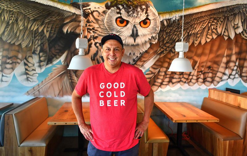 Chef/owner  Andy Gonzales stands in front of the mural by local artist Thomas Turner at the Companion. CONTRIBUTED BY CHRIS HUNT PHOTOGRAPHY