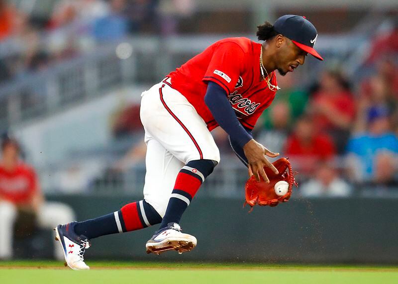 Braves second baseman Ozzie Albies fields a ground ball and throws to first in the sixth inning against the New York Mets Friday, April 12, 2018, at SunTrust Park in Atlanta.