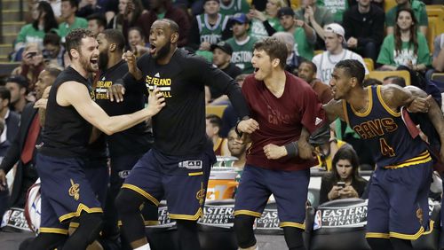 Cleveland Cavaliers (from left) Kevin Love, LeBron James, Kyle Korver and Iman Shumpert celebrate a basket during the second half of Game 5 of the NBA basketball Eastern Conference finals against the Boston Celtics, on May 25, 2017, in Boston. (AP Photo/Elise Amendola)