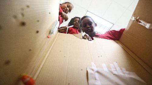 Students at McNair Discovery Learning Academy built traps to catch an endangered frog earlier this year (AJC FILE PHOTO)