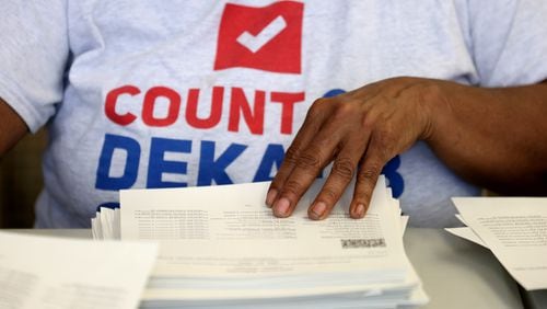 Election workers hand count advanced ballots at the DeKalb Voter Registration and Elections Office, Monday, May 30, 2022, in Decatur, Ga. (Jason Getz / Jason.Getz@ajc.com)