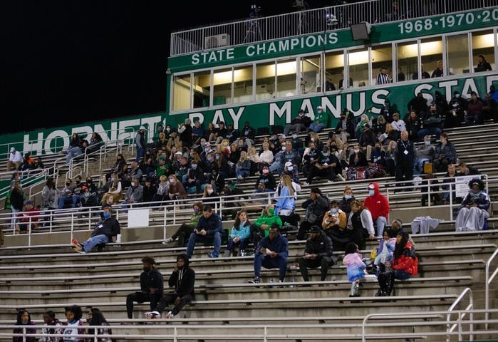 Roswell fans sit in the stands during the Mill Creek vs. Roswell high school football game on Friday, November 27, 2020, at Roswell High School in Roswell, Georgia. Mill Creek led Roswell 27-21 at the end of the third quarter. CHRISTINA MATACOTTA FOR THE ATLANTA JOURNAL-CONSTITUTION