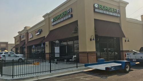 Construction is well underway at a new BurgerFi location on Duluth Highway near Lawrenceville. TYLER ESTEP /TYLER.ESTEP@AJC.COM