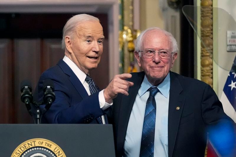 FILE - President Joe Biden stands with Sen. Bernie Sanders, I-Vt., after speaking about lowering health care costs in the Indian Treaty Room at the Eisenhower Executive Office Building on the White House complex in Washington, Wednesday, April 3, 2024. (AP Photo/Mark Schiefelbein)
