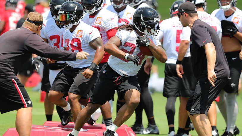 June 13, 2017, Flowery Branch: Falcons running back Devonta Freeman leads the way through a agility drill during the first day of mini-camp on Tuesday, June 13, 2017, in Flowery Branch. Curtis Compton/ccompton@ajc.com