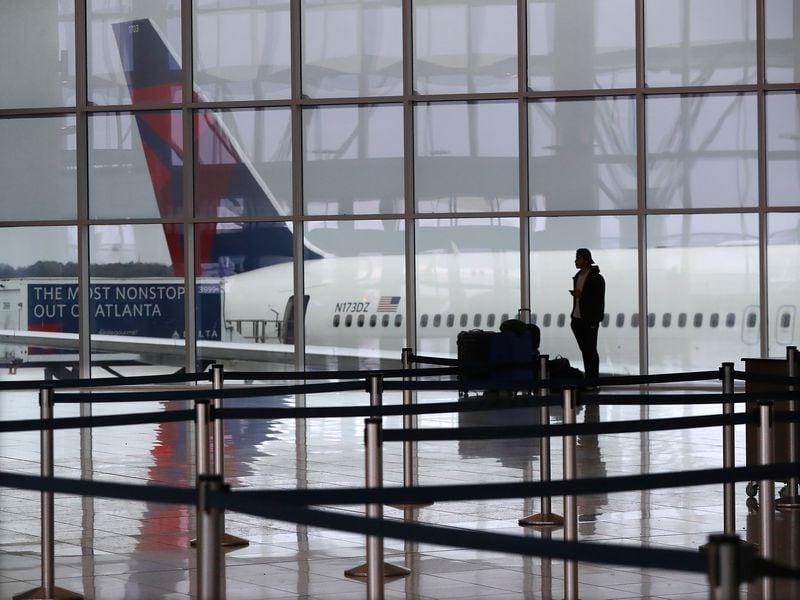 In this file photo, a Delta plane sits at the International Terminal at Hartsfield-Jackson International Airport. (Curtis Compton/Atlanta Journal-Constitution/TNS)