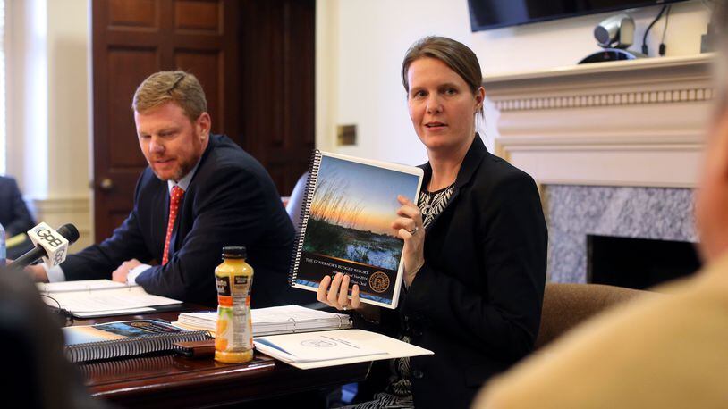 Deal administration officials, Chief of Staff Chris Riley (left) and Office of Planning and Budget Director Theresa MacCartney brief the press on the FY 2017 budget. Bob Andres, bandres@ajc.com