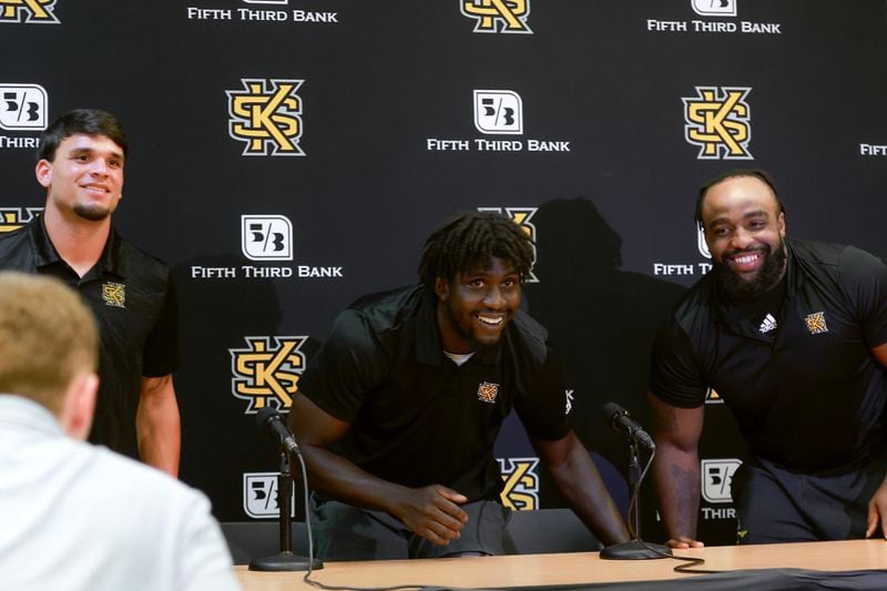 Kennesaw State players Isaac Foster (left), Jonathan Murphy (middle) and Preston Daniels prepare to speak to the media about the upcoming football season on Monday, July 24, 2023. (Natrice Miller/ Natrice.miller@ajc.com)
