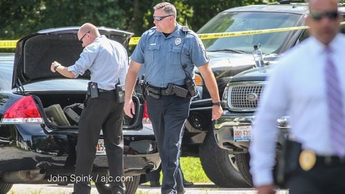 Investigators work at the home where four children and their father were stabbed to death on July 6, 2017 on Emory Lane in Loganville. A fifth child was hospitalized with serious injuries. (John Spink / jspink@ajc.com)