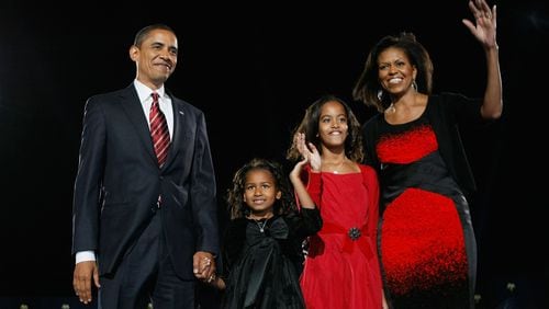 U.S. President elect Barack Obama stands on stage along with his family during an election night gathering in Grant Park on November 4, 2008 in Chicago, Illinois. (Photo by Joe Raedle/Getty Images)
