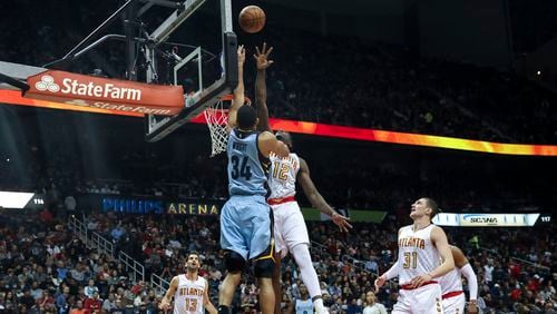 Memphis Grizzlies forward Brandan Wright (34) drives to the basket and shoots during the first half of the team’s NBA basketball game against the Atlanta Hawks, Thursday, March 16, 2017, in Atlanta. The Grizzlies defeated the Hawks 103-91. (AP Photo/Branden Camp)