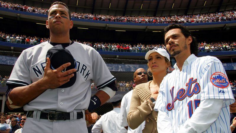 NEW YORK - MAY 21:  (L-R) Alex Rodriguez #13 of the New York Yankees stands for the National Anthem with Jennifer Lopez and husband Mark Anthony before the game against the New York Mets on May 21, 2005 at Shea Stadium in the Flushing neighborhood of New York City. The Mets defeated the Yankees 7-1.  (Photo by Chris Trotman/Getty Images)