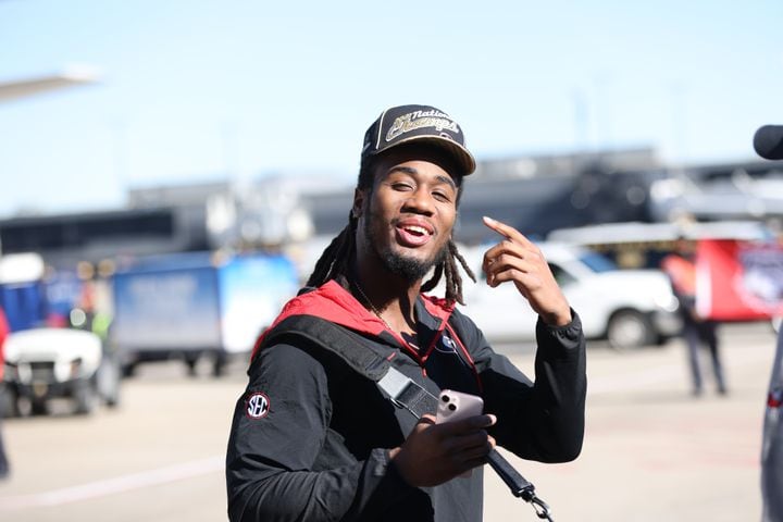 Georgia Bulldogs running back James Cook reacts to the members of the press as the team arrives. Miguel Martinez for The Atlanta Journal-Constitution