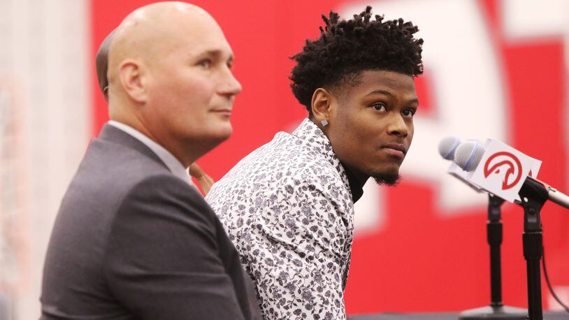 Atlanta Hawks General Manager Travis Schlenk and Hawks 2019 draft pick Cam Reddish listen to a question at Reddish's introductory press conference at the Hawks practice facility, in the Emory Sports Medicine Complex, in Brookhaven, Georgia on Monday June 24, 2019. Reddish was selected by the Atlanta Hawks in the 2019 NBA Draft on  June 20, 2019, and was the 10th overall pick. Reddish previously played small forward/shooting guard for the Duke University Blue Devils. Christina Matacotta/CHRISTINA.MATACOTTA@AJC.COM