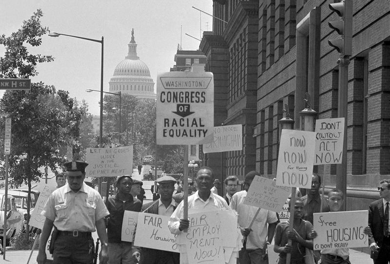 FILE - Demonstrators march down North Capital Street during protest march within sight of the capitol in Washington, June 14, 1963. They’re hallmarks of American history: protests, rallies, sit-ins, marches, disruptions. They date from the early days of what would become the United States to the sights and sounds currently echoing across the landscapes of the nation’s colleges and universities. (AP Photo/John Rous, File)