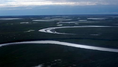 This July 8, 2004, photo provided by the United States Geological Survey shows Fish Creek through the National Petroleum Reserve-Alaska, managed by the Bureau of Land Management on Alaska's North Slope. (David W. Houseknecht/United States Geological Survey via AP)