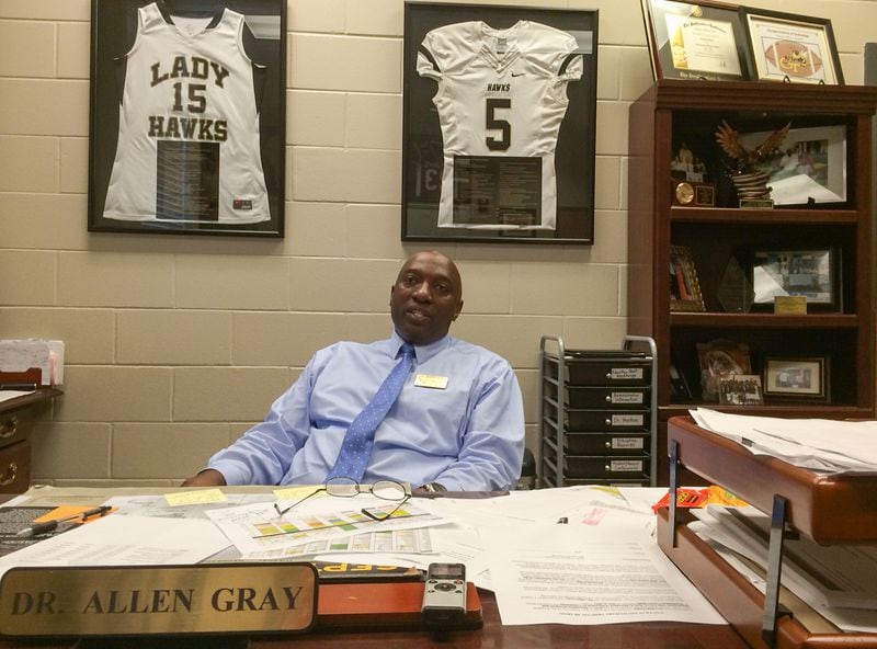 In the principal's office at Washington County High School, Allen Gray is never far from the reminders of his children's accomplishments there. (Steve Hummer/AJC)